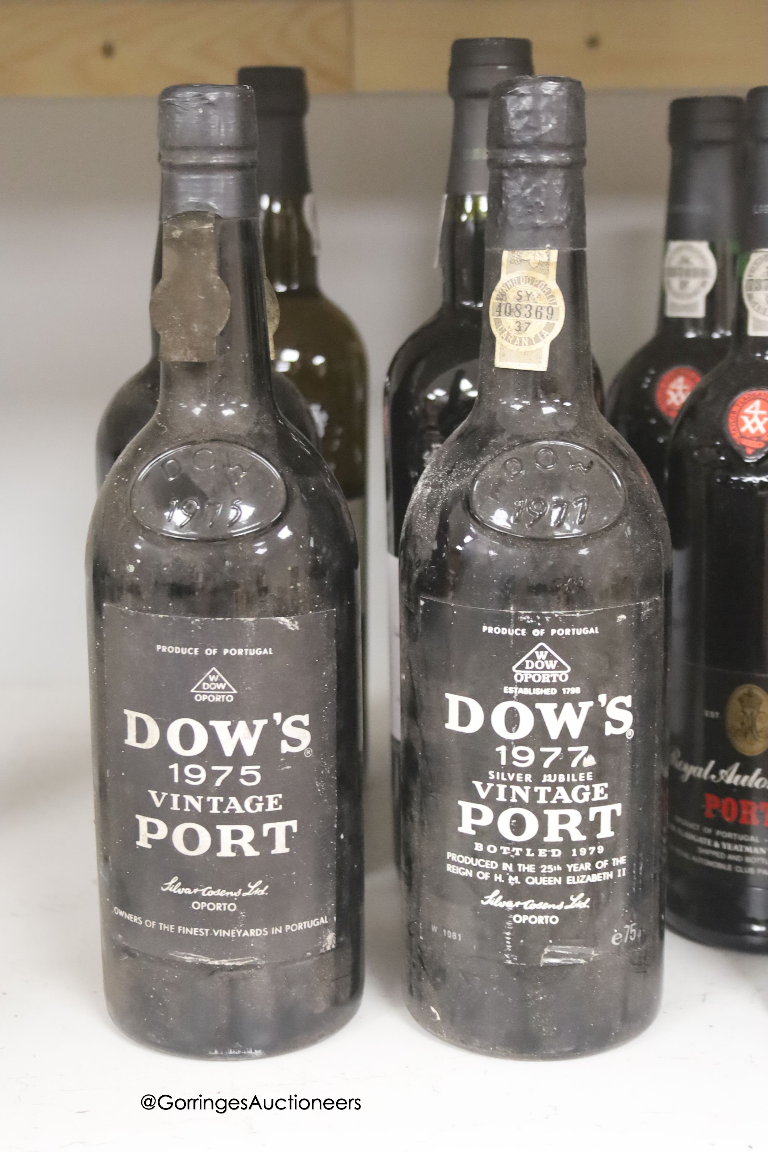 Thirteen assorted bottles of Port including Dow's 1975 and 1977 and one bottle of Magloire Calvados